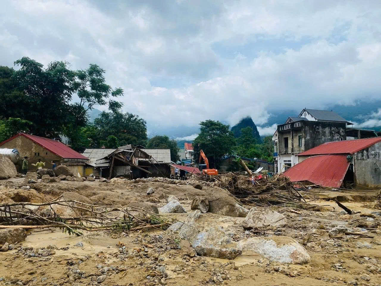 A destroyed building in a villageAI-generated content may be incorrect.